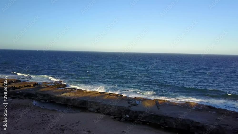 Aerial Drone Panning Around A Rocky Shoreline In Yamba Australia With Rock Pools And Crashing Waves Aerial Drone Panning Around A Rocky Shoreline In Yamba Australia With Rock Pools And Crashing Waves