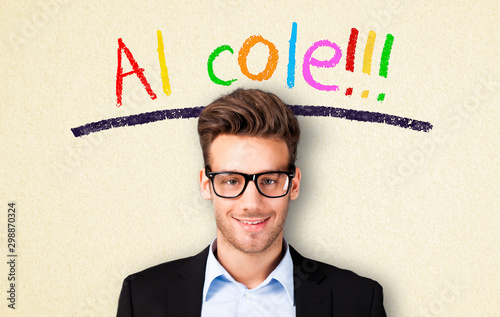 young man with glasses and Spanish message for "school!!!" 