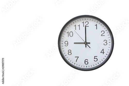 Wall clock hanging on a white background.