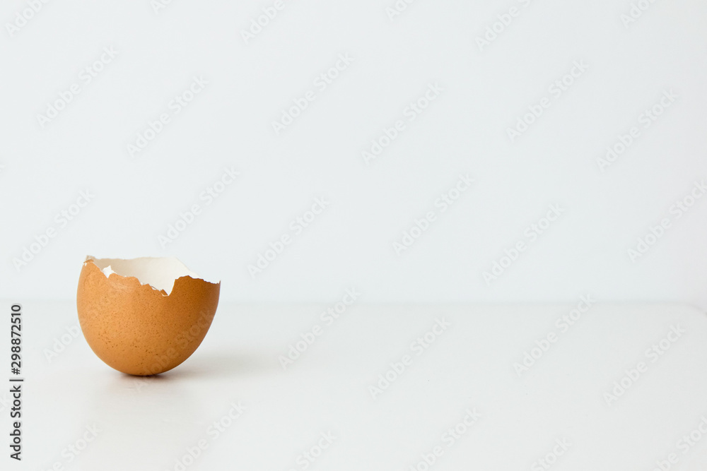 half broken brown egg isolated on white background half broken brown egg isolated on white background