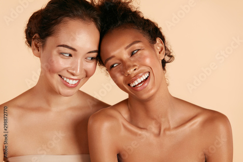 Beauty. Smiling women with perfect face skin and natural makeup portrait. Bea...