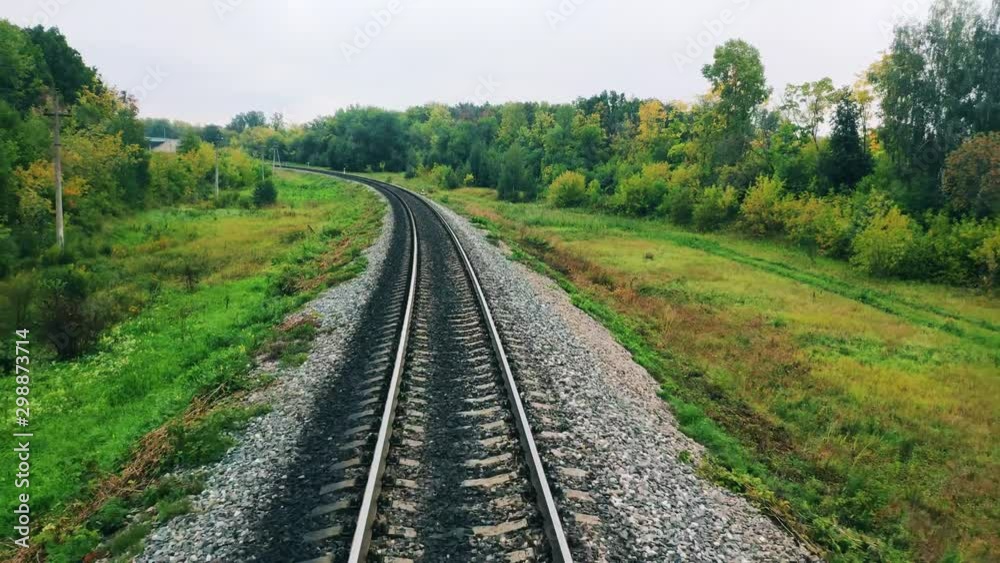 Green trees and railway seen while riding Green trees and railway seen while riding