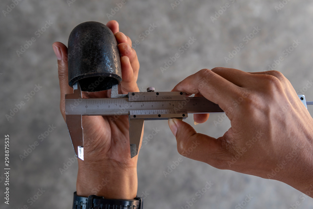 Using Vernier caliper to measure the dimensions inside diameter of the Elbow Pipe Fittings