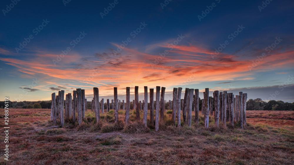 Tomb from the early bronze age on Regte Heide heathland at sunset, the Netherlands