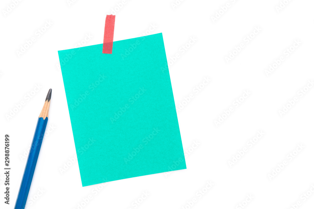 Empty colorful paper sheet with masking tape on black chalkboard surface. Copy space for add text or art work designs. Empty colorful paper sheet with masking tape on black chalkboard surface. Copy space for add text or art work designs.
