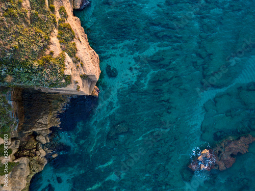 Aerial view of rocks in the sea. Overview of the seabed seen from above, transparent water. Seabed. Pizzo Calabro, Calabria, Italy
