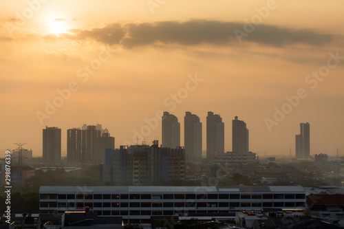 Beautiful aerial cityscape view of the skyline of Jakarta (seen from Kota tua aka old town or Batavia), Indonesia, at sunrise © dennisvdwater