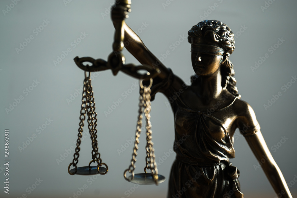 Themis figurine.Weight of justice. The criminal law. Low concept Themis figurine.Weight of justice. The criminal law. Low concept