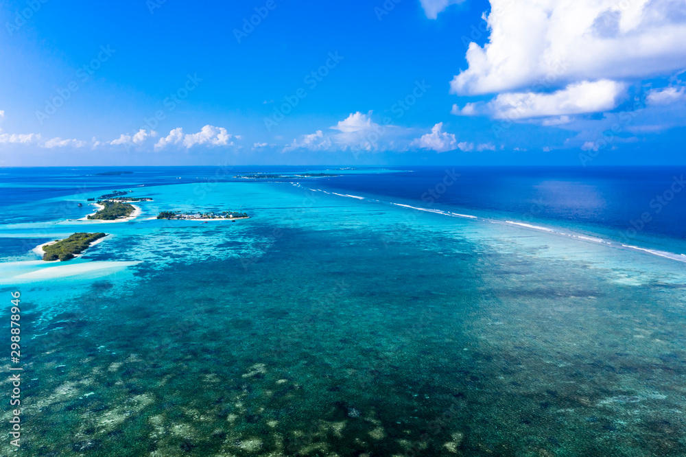 Aerial view, lagoon of a Maldives island with corals from above, South Male Atoll, Maldives