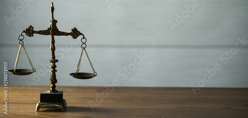 Wooden judge`s gavel. Themis figurine. The criminal law. Low concept.