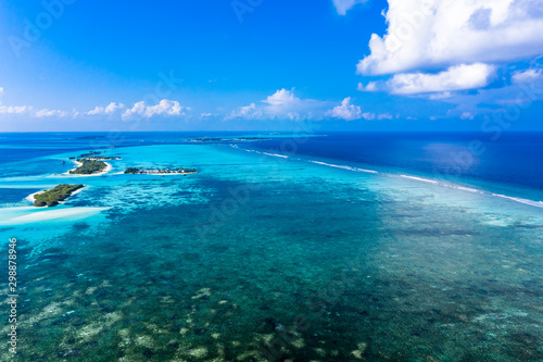 Aerial view, lagoon of a Maldives island with corals from above, South Male Atoll, Maldives © David Brown
