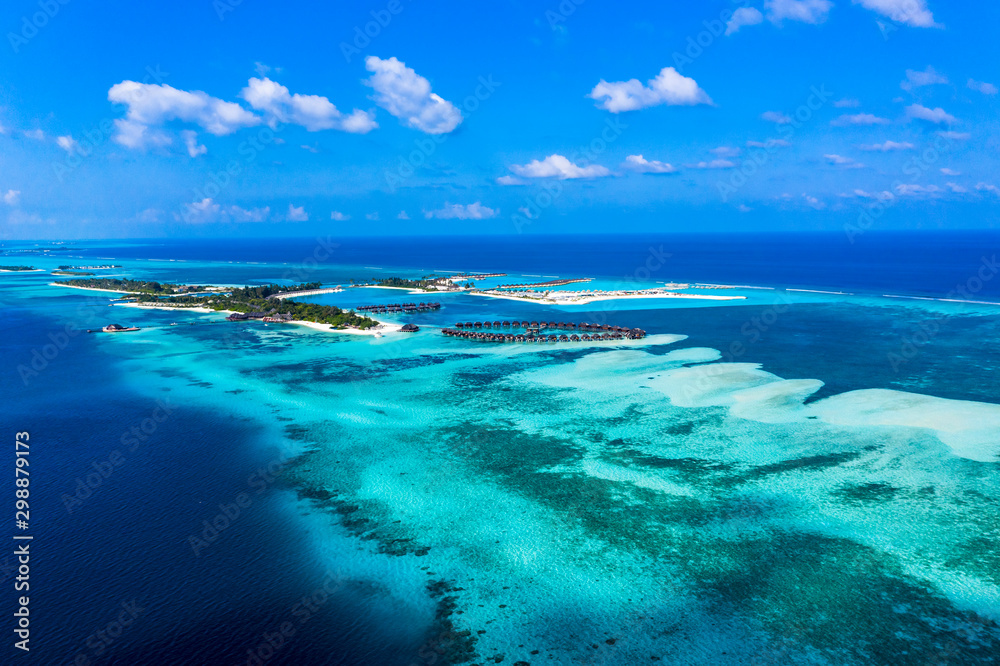 Aerial view, lagoon of Maldives island Olhuveli with water bungalows South Male Atoll, Maldives