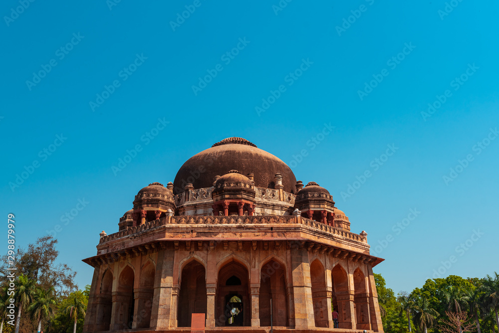 Close up of the tomb of Mohammed Shah at the Lodhi Garden with blue sky background.