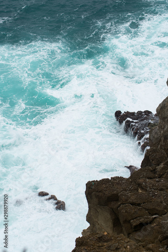 waves crashing on rocks