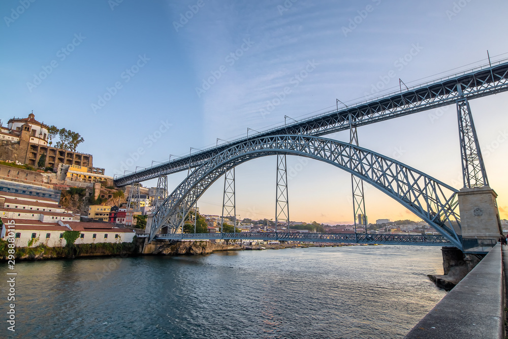 bridge of Dom Luis I (constructed in 1886) in old Porto at sunset