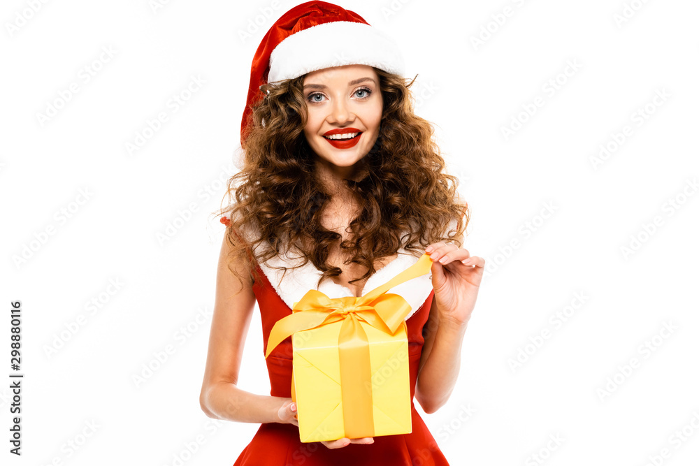 beautiful smiling girl in santa costume holding christmas present, isolated on white beautiful smiling girl in santa costume holding christmas present, isolated on white