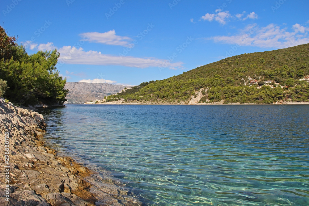 Beautiful landscape of sea Coast of Adriatic sea with Transparent Blue Water in Pucisca, Croatia. Island of Brac summertime.