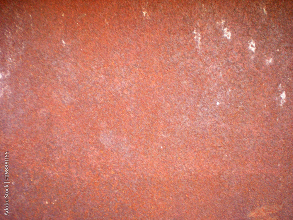 Textural background of an old, rusty metal sheet in red Textural background of an old, rusty metal sheet in red