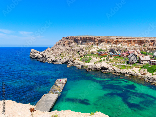 Fototapeta Naklejka Na Ścianę i Meble -  Beautiful Anchor Bay with azure and clear water. Malta.