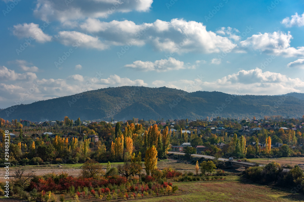 Naklejka premium Small village in mountainous area at autumn season