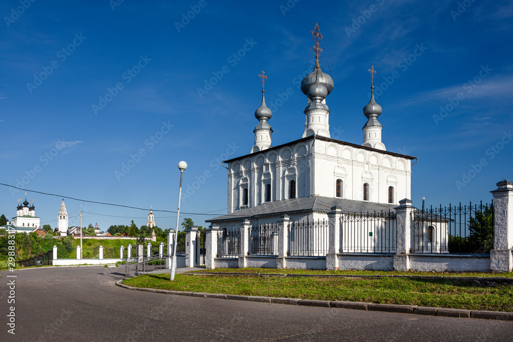 Russia, Vladimir Oblast, Suzdal: Panorama view of famous Peter and Paul church next to Intercession Convent with blue sky in the center of one of the oldest Russian towns and Alexandrovsky Convent.