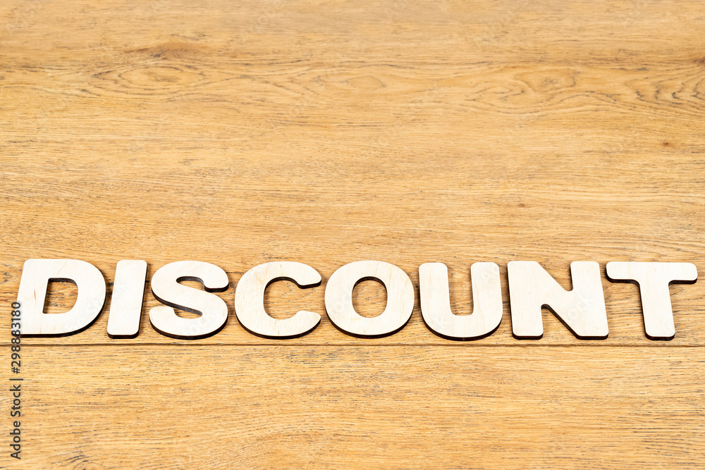 word discount of wooden letters on table word discount of wooden letters on table
