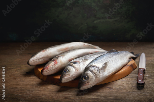 Photography fresh fish are ready for cooking on a wooden table