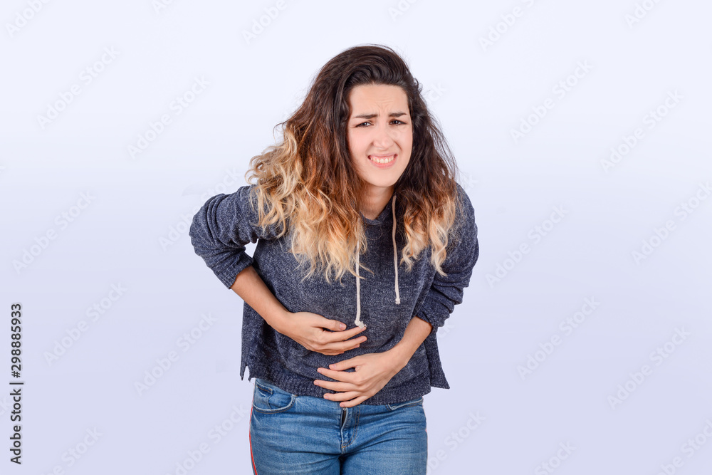 Young woman is having stomach ache. Young woman is having stomach ache.