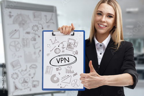 Business, technology, internet and network concept. Young businessman shows a key phrase: VPN