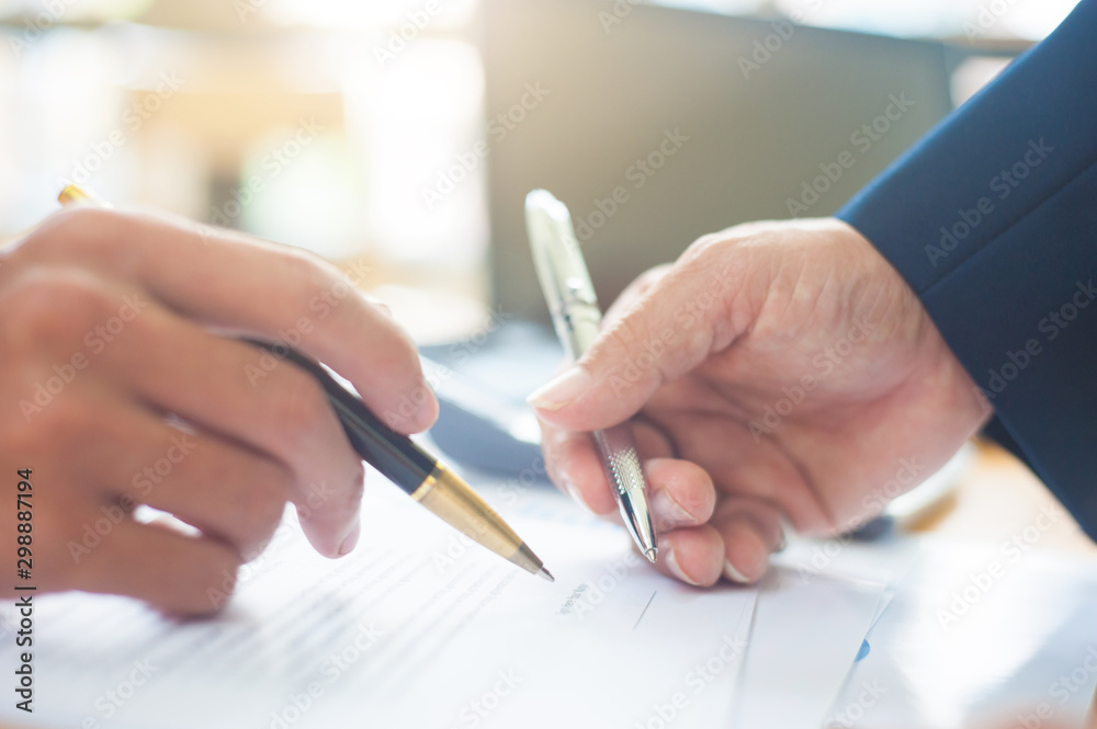Close up of a business person who signs an agreement. Concept of contract signing. Close up of a business person who signs an agreement. Concept of contract signing.