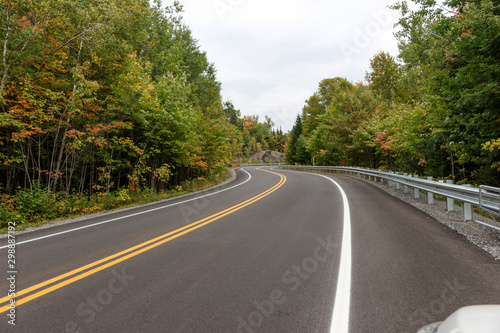 Empty curvy road in the Mauricie National Park in Canada. Quebec
