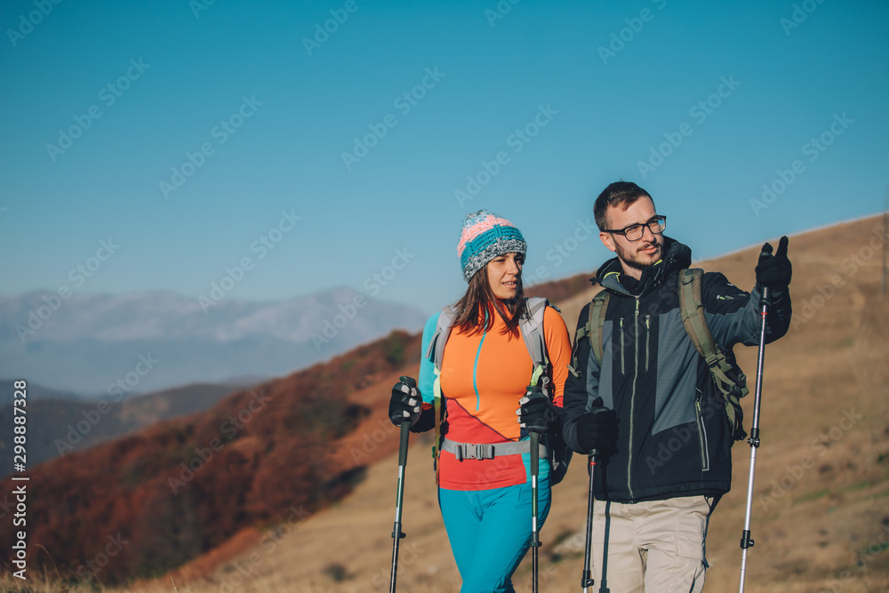 Couple hikers on a mountaintop