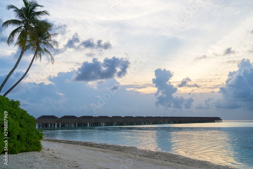 Wooden bridges leading to the huts on the shores of the tropical