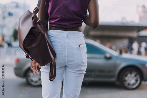Back view of woman rear in white jeans