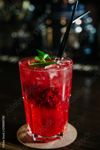 Wallpaper Mural A red drink in a glass with ice cubes, strawberries,straw and mint leaves Torontodigital.ca