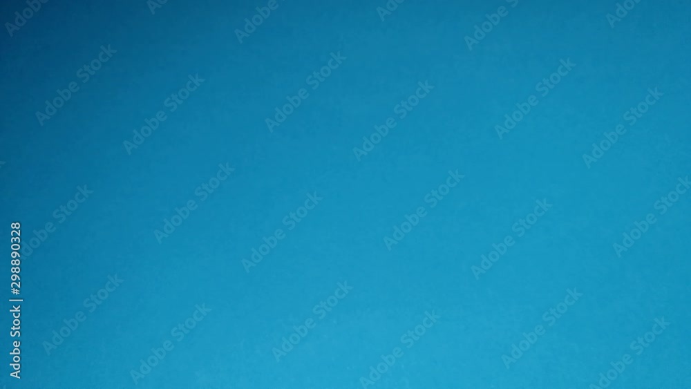 Red apple on a blue background close-up. Red apple on a blue background close-up.
