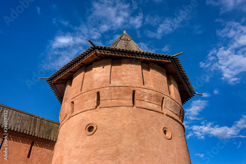 Russia, Vladimir Oblast, Suzdal: Fortified tower donjon of famous old Saviour Monastery of Saint Euthymius from above with blue sky in the city center of one of the oldest Russian - concept history photo