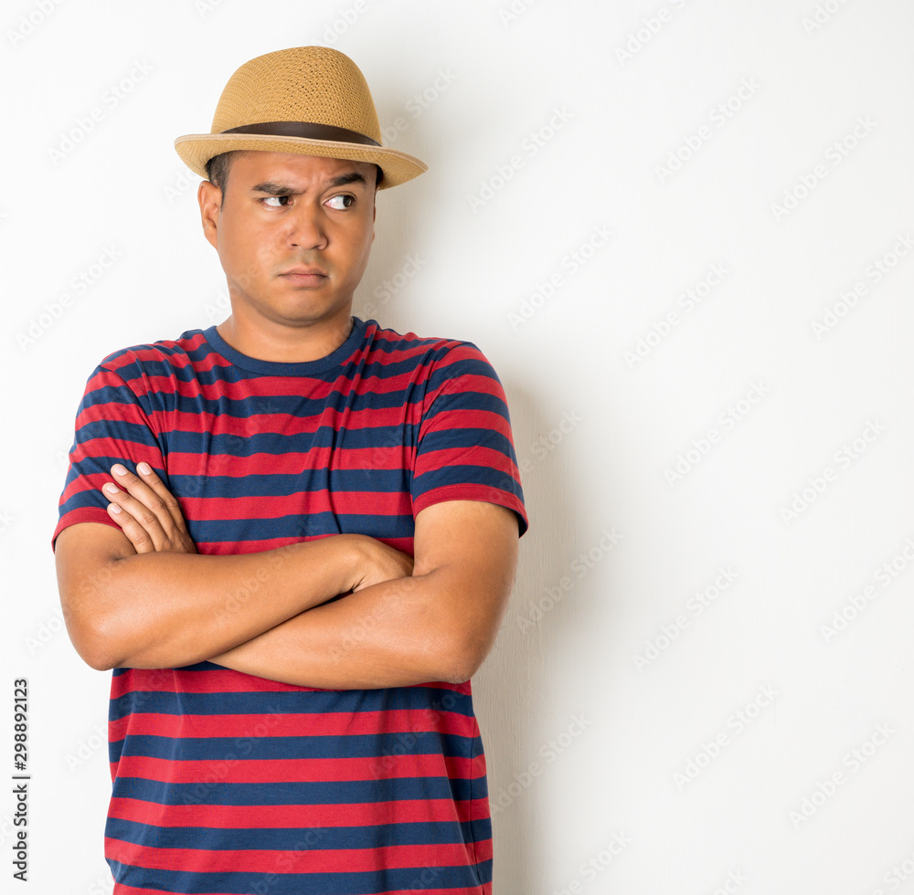 Asian men around the age of 27-35 are thinking and making faces, confused, not understanding, wondering with something. This photo was taken in the studio. With a white background
