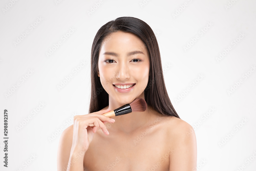 Beautiful Asian young woman smile and holding make up brush with healthy Clean and Fresh skin feeling so happiness and cheerful,Isolated on white background,Beauty Cosmetics Concept Beautiful Asian young woman smile and holding make up brush with healthy Clean and Fresh skin feeling so happiness and cheerful,Isolated on white background,Beauty Cosmetics Concept
