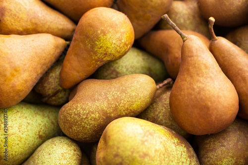 Pears. Natural background of fresh juicy brown ripe pears. Close Up of pears in box. Harvest  vitamins  vegetarians  fruits  crop. Organic gardening. Long-term storage. Organic pear for food or juice.