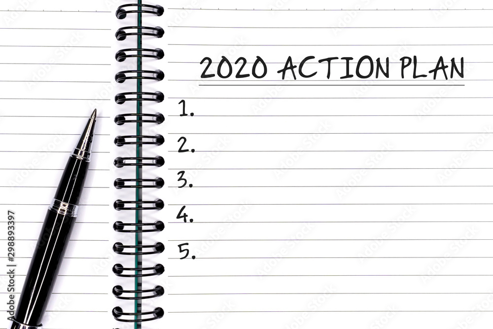 New Year concept - 2020 Action plan text on notepad with pen.