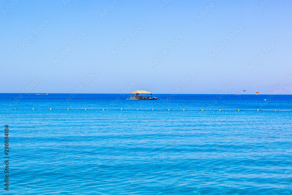 rustic wooden lonely bungalow surrounded by Red sea waters summer vacation relaxation place tropic concept photography with empty background space for copy or your text