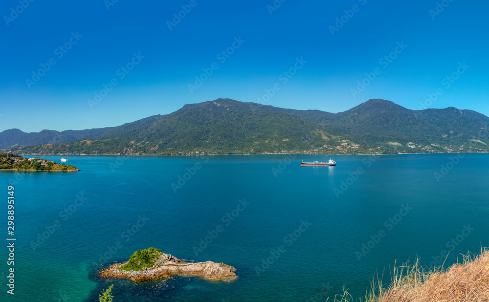 Beautiful panoramic view of Ilhabela island and coast of Sao Sebastiao, tropical island on the Brazilian sea coast during a sunny day of vacation and sightseeing.