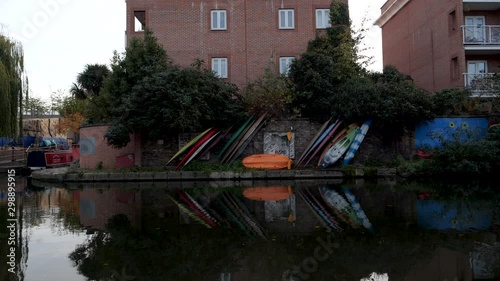 Colourful Kayaks reflecting in the canal water