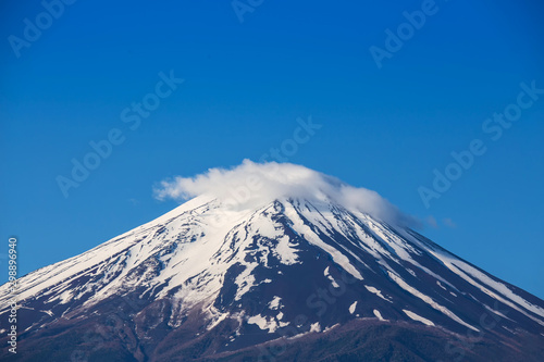 Close up top of beautiful Fuji mountain with snow cover on the top with could, Mount Fuji, Fujisan located on Honshu Island, is the highest mountain in Japan.