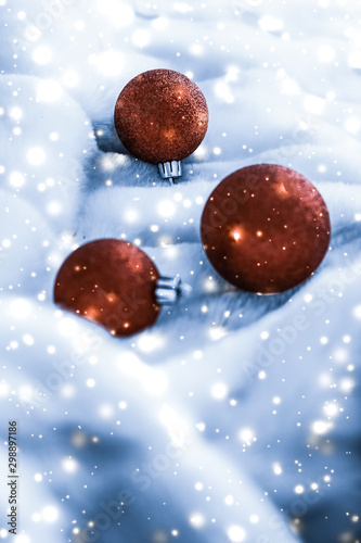 Canvas Print Bronze Christmas baubles on blue fluffy fur with shiny snow glitter, luxury wint