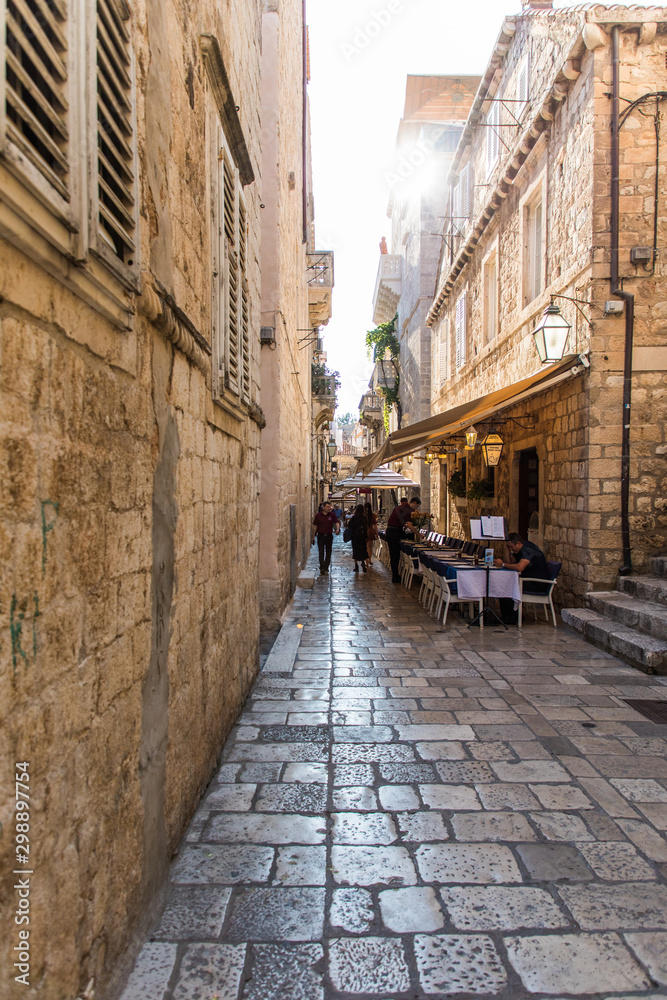 Dubrovnik, Croatia - July, 2019: Picturesque narrow street in Dubrovnik, Croatia. Dubrovnik joined the UNESCO list of World Heritage Sites