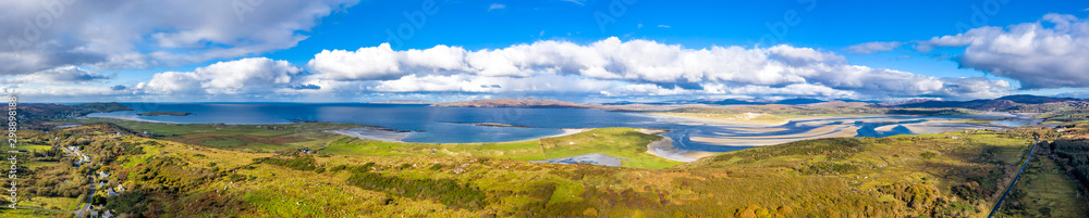 Aerial view of the coastline seen from Clooney towards Portnoo and Lettermacaward County Donegal . Ireland
