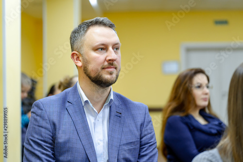 Closeup portrait of businessman in white collar shirt and suit. Businessman concept. © Vadim