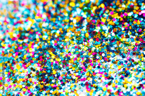 Background from colored confetti. Blur effect on part of the photo